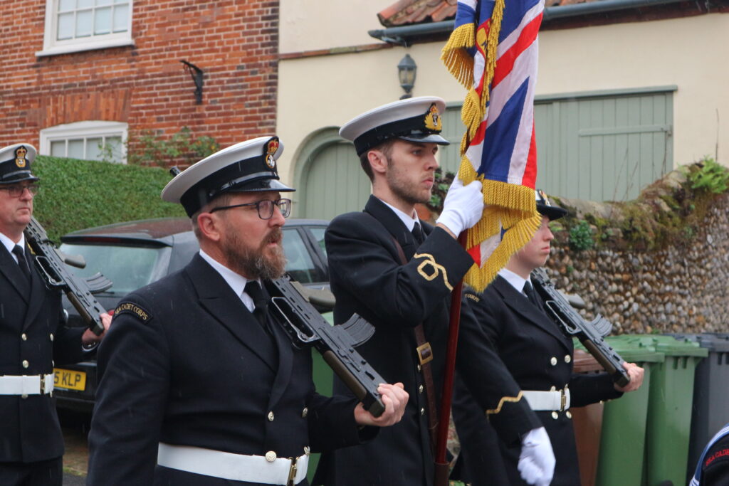 Norwich Sea Cadets Officer in Charge Carries the Colour